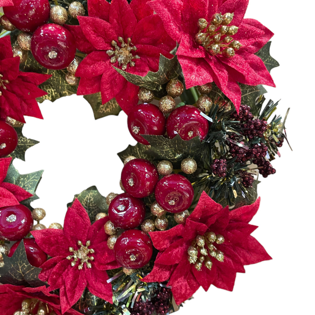 Artificial wreath with red poinsettias & berries