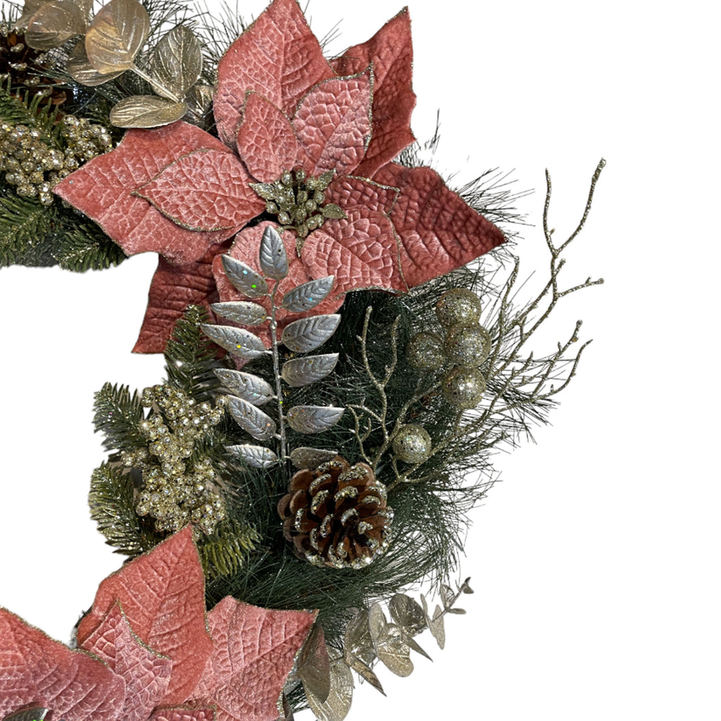 Artificial wreath with pink poinsettias, silver leaves & pine cone