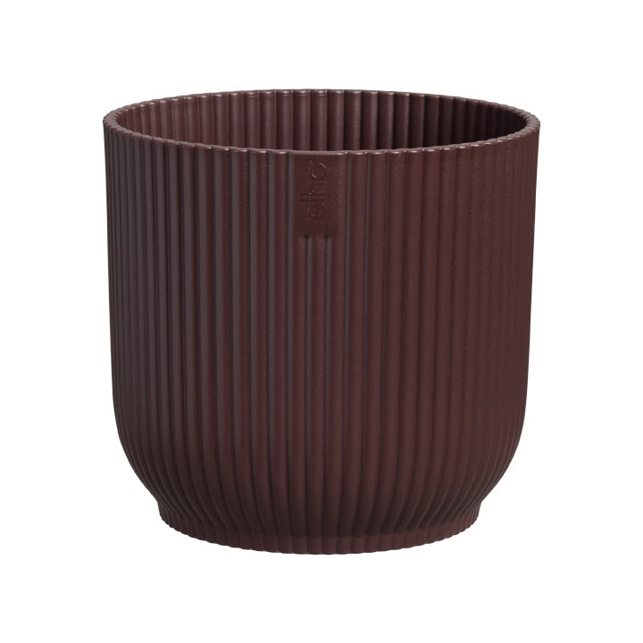 Wine Red ribbed pot on a white background